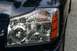 2007 Nissan Titan - Close-up of a truck's front headlight assembly, showing the turn signal and headlight lens.