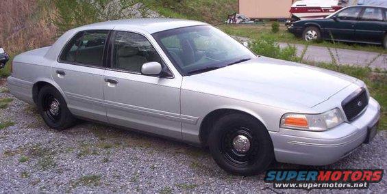 Silver 2002 Ford Crown Victoria, 3q front view, black wheels
