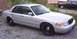 2002 Ford Crown Victoria - This silver 2002 Ford Crown Victoria is shown from a three-quarter front angle, black steel wheels.