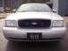 2002 Ford Crown Victoria - Front view of a 2002 Ford Crown Victoria, showing the grille and headlights.