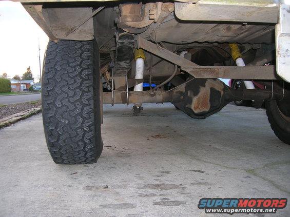1978 Ford F-250 rear axle, leaf springs, and shocks. Tire is visible on the left
