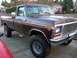 1978 Ford F-250 - This 1978 Ford F-250 pickup truck features a two-tone brown paint scheme and a lifted suspension.
