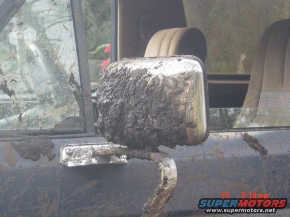 Mud-covered side mirror on 1986 Ford Bronco