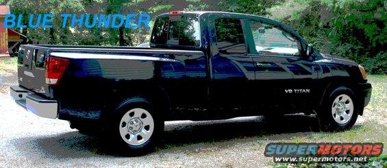 Dark blue 2007 Nissan Titan pickup truck parked outside