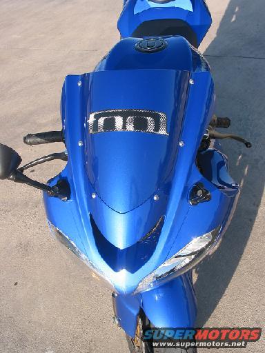 Blue sport motorcycle front view. Has a logo on the windshield