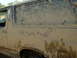 1991 Ford Bronco - This mud-splattered SUV has a humorous message scrawled on its side, asking "Got more mud?"