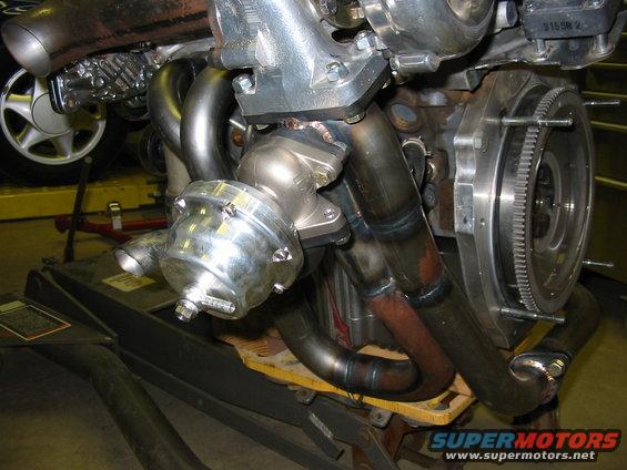 turbocharger with wastegate attached to custom exhaust manifold