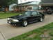 1988 Ford Mustang - 1988 Ford Mustang with custom hood and wheels, parked in front of a suburban house.