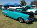 2002 Ford Mustang - A turquoise and white 1957 Chevrolet Bel Air is displayed with its hood open, alongside other vehicles under tents.