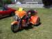 2002 Ford Mustang - Custom trike motorcycle with flame paint job and an American flag on the back.