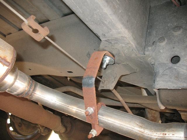 Exhaust system with rusty bracket and clamp