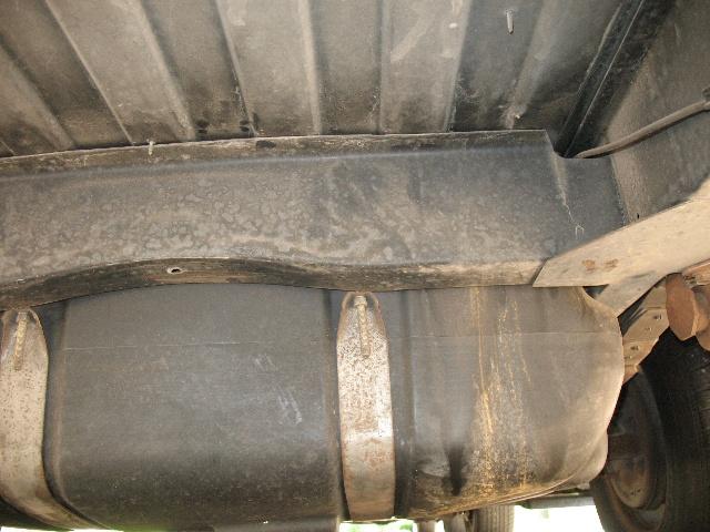 underbody view of a vehicle's fuel tank and frame