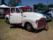 2002 Ford Mustang - A classic GMC pickup truck is displayed outdoors with other vehicles.