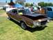 2002 Ford Mustang - Brown 1972 Ford Gran Torino Sport coupe with chrome trim and a scoop on the hood.