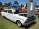 2002 Ford Mustang - A white Ford Falcon pickup truck is displayed with its hood open at an outdoor car show.