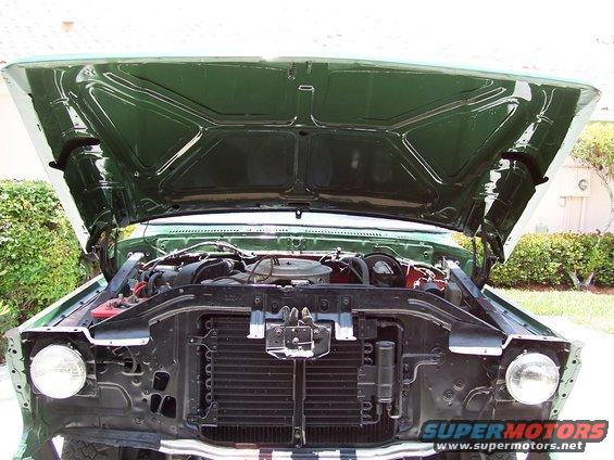 1978 Ford Bronco engine bay with hood open, showing engine and radiator