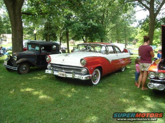 Red and white 1955 Ford Fairlane Crown Victoria, 3q-front view