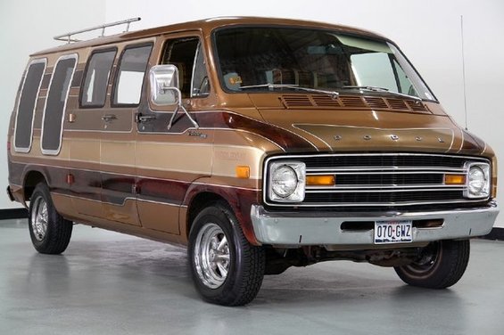 Brown Dodge van with custom stripes and roof rack. License plate reads 070-GHZ