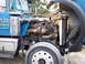 1981 Kenworth W900A - Close-up view of a truck's engine compartment, revealing the complex network of hoses, pipes, and the turbocharger.