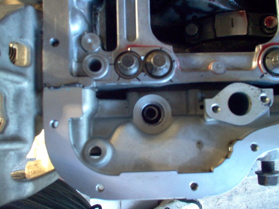 Close-up of engine block with bolts and gasket