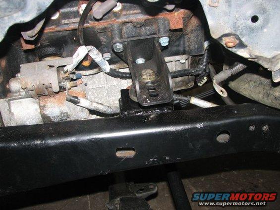 Engine mount and starter motor on a vehicle frame