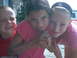 2003 Yamaha RAPTOR 80 - Three children pose for a photo while holding a small animal. A vehicle is visible in the background.