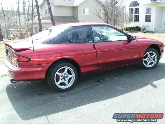 1996 Ford Probe coupe, side view, red paint