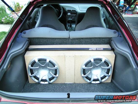 1996 Ford Probe interior showing front seats and trunk with dual subwoofers
