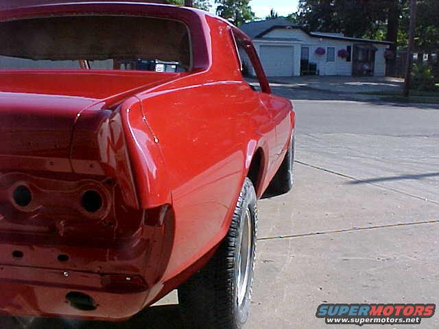 Red 1967 Mercury Cougar rear quarter panel and taillight area