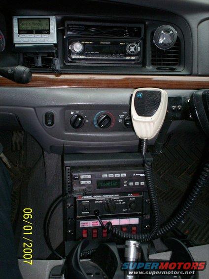Police car interior with radio equipment and a date stamp of 06/01/2007