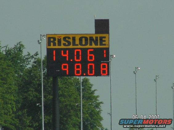 Digital scoreboard displaying 'RISLONE' and race times '14.06 1' and '-98.08'