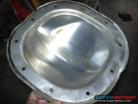 Metal differential cover with bolt holes around the edge
