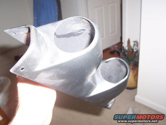 Silver plastic gauge pod with two circular openings
