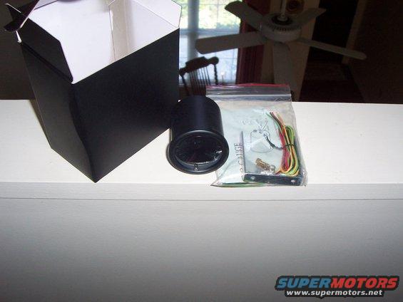 Black gauge with wiring kit and open box