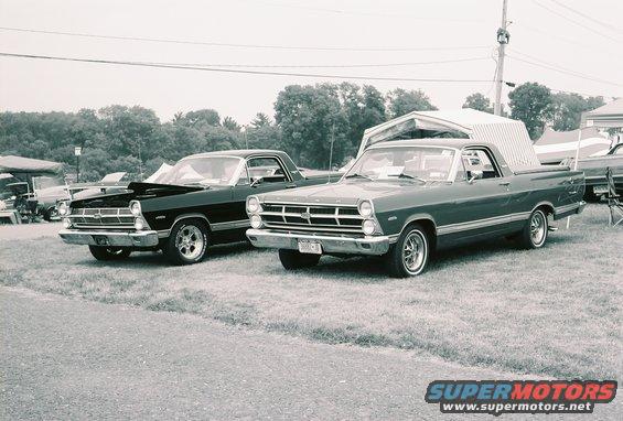 Two 1966 Ford Rancheros parked side-by-side, one dark, one green