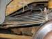 2001 Ford Excursion - This shows the stance of my modded F code springs with the 3rd leaf from the bottom of the original rear leaf pack (the…