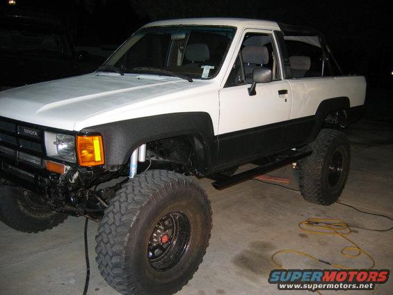 White and black 1985 Toyota 4Runner with lifted suspension and off-road tires