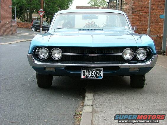 Front view of a blue 1970 Ford Ranchero with dual headlights and a black license plate