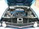 1970 Ford Ranchero - The engine bay of a blue 1970 Ford Ranchero, its V8 engine and prominent air cleaner assembly.