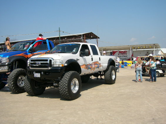 White Ford F-Series truck with custom graphics and lifted suspension
