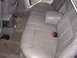 1995 Ford Taurus - Interior view of a car's rear seating area, showing the bench seat and center console.