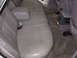 1995 Ford Taurus - Interior view of gray leather rear seats and center console.