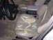 1995 Ford Taurus - The interior of a car shows significant wear and tear on the seats.