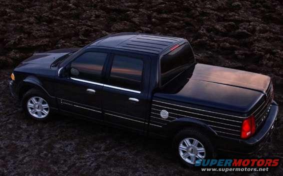 Black pickup truck with chrome trim and tonneau cover, 3q front view