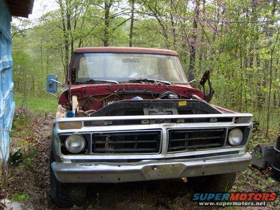 Red 1976 Ford F-100 front view, hood open, showing engine bay