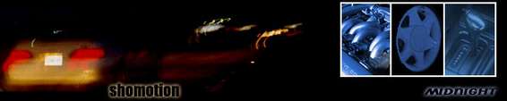 Yellow car rear view at night, with red taillights and a white license plate