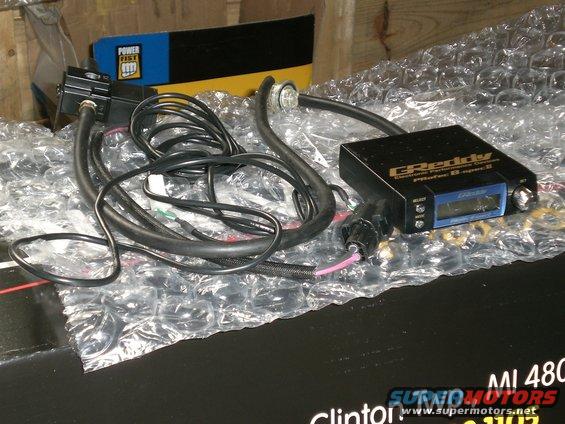 Greddy Electronic Performance Controller with wires and a Power Fist box