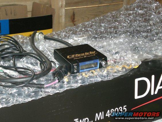 GReddy Profec B-spec II electronic boost controller with wires and bubble wrap