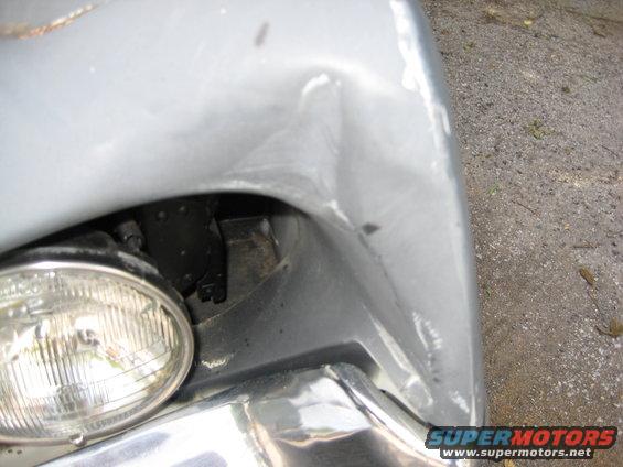 left front corner- close up of dent