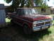 1977 Ford F-150 - This 1977 Ford F-150 pickup truck is parked outside a building.
